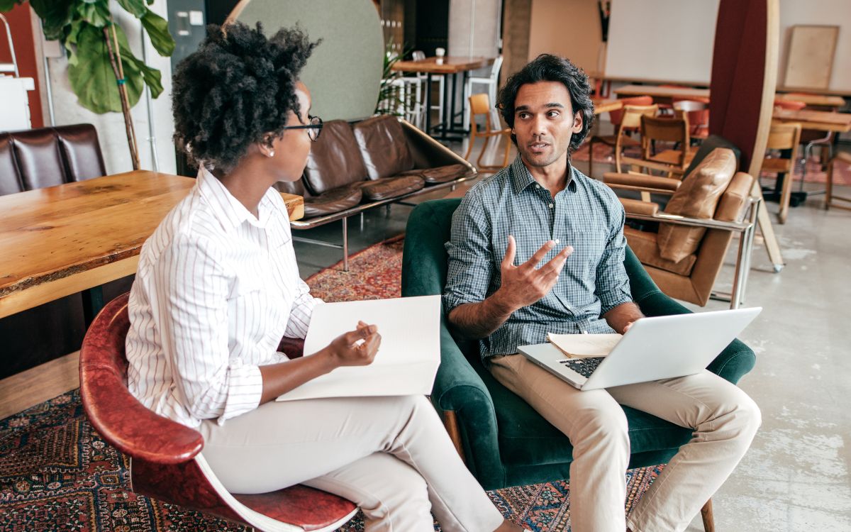 Two people sitting and talking together