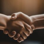 two people shaking hands